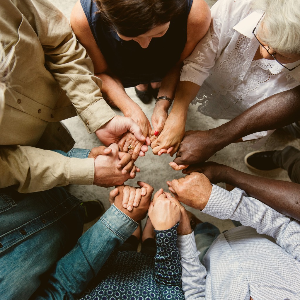 Group of people holding hands